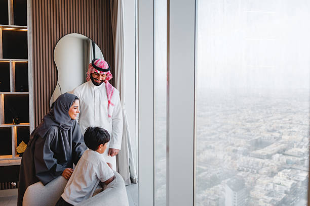 istock Middle Eastern Family Enjoying Scenic Riyadh View From Luxury Apartment Window 2242939807