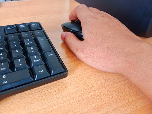 Businesswoman hand on computer keyboard.