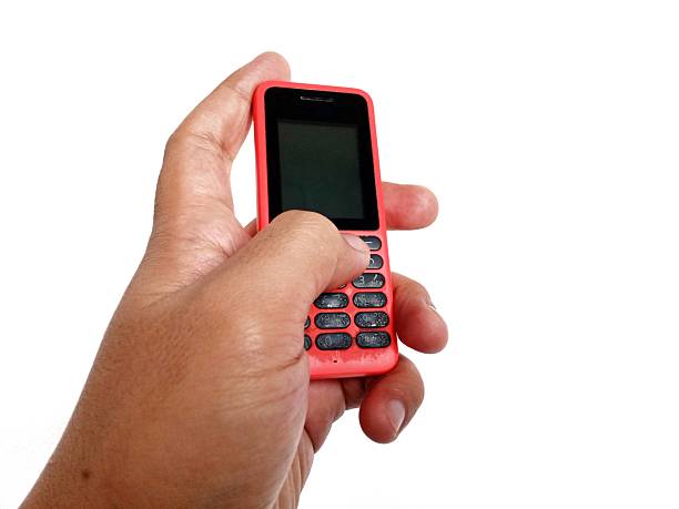 istock Jakarta, Indonesia, hand pose holding an old cellphone 2242939833