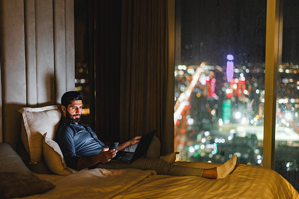 istock Arabic Businessman in Luxury Hotel Room Reading Message on Smartphone While Working 2242939931