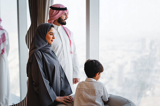 istock Middle Eastern Family Observing Riyadh Skyline From Modern Luxury Apartment Window 2242940057