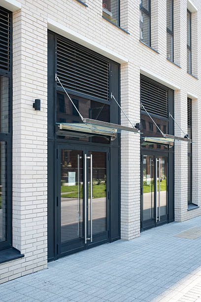 istock Sleek Entrance of Modern White Brick Building 2242941561