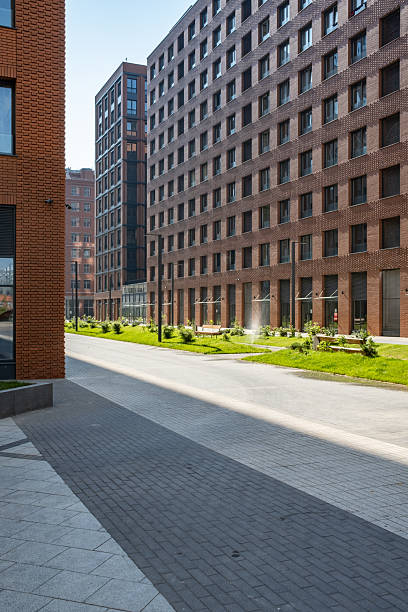 istock Sunny Promenade in Modern Red Brick District 2242941630