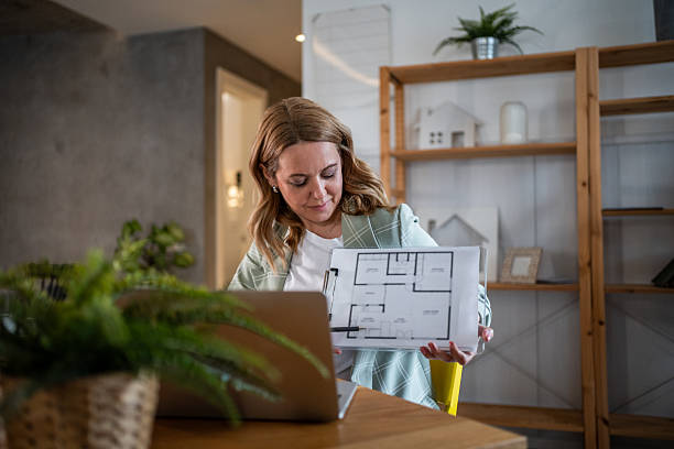 istock Real estate agent showing floor plan during online meeting 2242944135