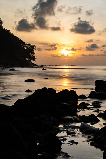 istock rocky beach at morning blue hour with waves and dramatic clouds 2242945733