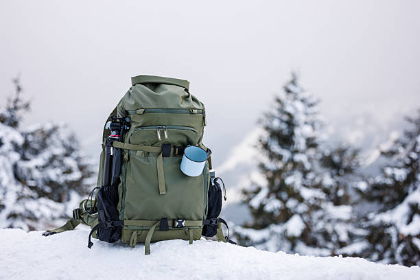 istock Hiking backpack in winter mountains with snow covered trees 2242949622