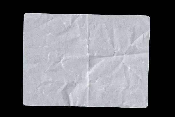 istock White adhesive glued paper sticker label on isolated black 2242954456