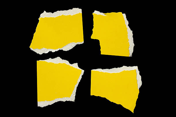 istock Ripped yellow paper torn edges isolated on black 2242954533