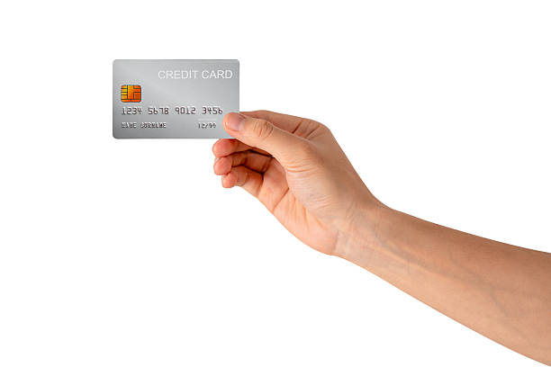 istock A hand holding a credit card isolated on white background. High quality studio shot. This concept is suitable for technology, business, finance, shopping, lifestyle, product mockups, and advertising. 2242954932