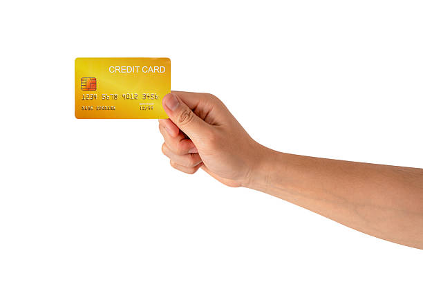 istock A hand holding a credit card isolated on white background. High quality studio shot. This concept is suitable for technology, business, finance, shopping, lifestyle, product mockups, and advertising. 2242954933
