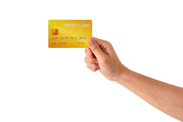istock A hand holding a credit card isolated on white background. High quality studio shot. This concept is suitable for technology, business, finance, shopping, lifestyle, product mockups, and advertising. 2242954935