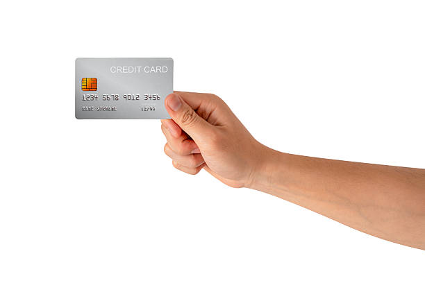 istock A hand holding a credit card isolated on white background. High quality studio shot. This concept is suitable for technology, business, finance, shopping, lifestyle, product mockups, and advertising. 2242954936