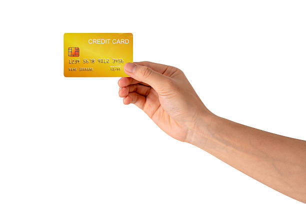 istock A hand holding a credit card isolated on white background. High quality studio shot. This concept is suitable for technology, business, finance, shopping, lifestyle, product mockups, and advertising. 2242954937