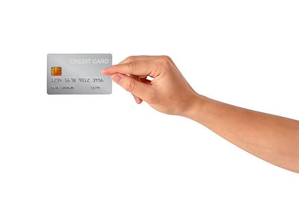 istock A hand holding a credit card isolated on white background. High quality studio shot. This concept is suitable for technology, business, finance, shopping, lifestyle, product mockups, and advertising. 2242954971