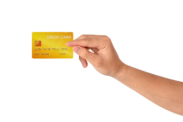 istock A hand holding a credit card isolated on white background. High quality studio shot. This concept is suitable for technology, business, finance, shopping, lifestyle, product mockups, and advertising. 2242954984