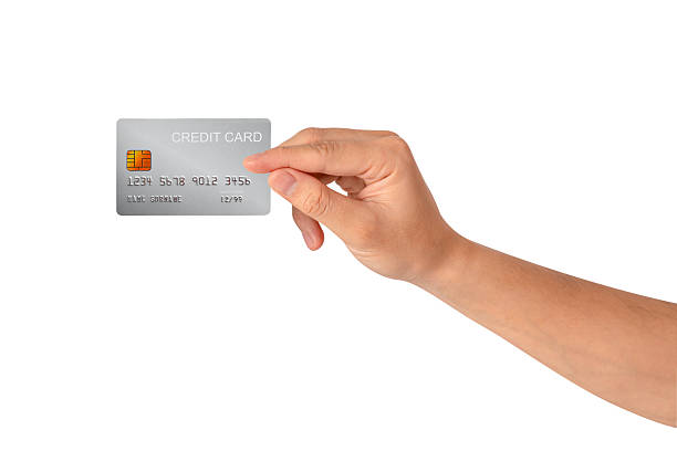 istock A hand holding a credit card isolated on white background. High quality studio shot. This concept is suitable for technology, business, finance, shopping, lifestyle, product mockups, and advertising. 2242955005