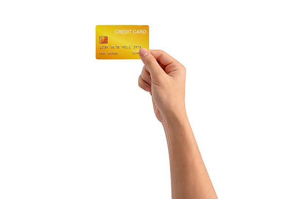 istock A hand holding a credit card isolated on white background. High quality studio shot. This concept is suitable for technology, business, finance, shopping, lifestyle, product mockups, and advertising. 2242955177
