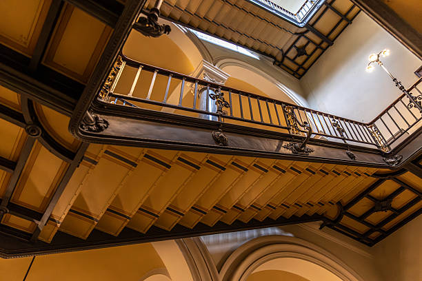 istock Looking up through history. Elegant staircase in old building. 2242955845
