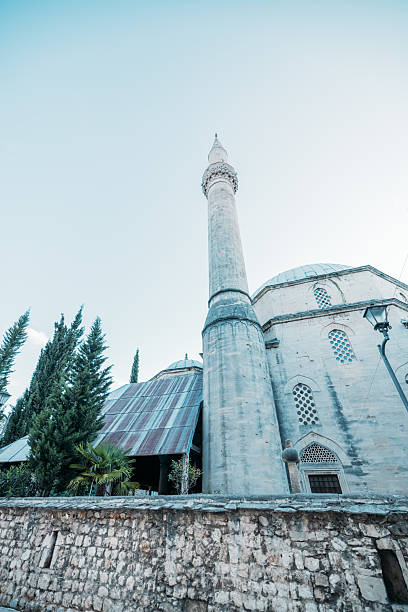 istock Historic Mosque with Tall Minaret and Stone Wall 2242957221