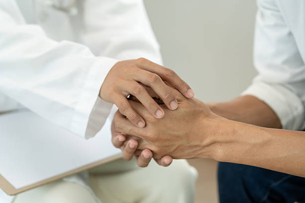 istock psychiatrist hold hand support each while discussing family issues. doctor encourages and empathy man suffers depression. psychological, save divorce, Hand in hand together, trust, care 2242957427