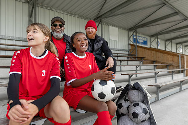 istock Fathers and daughters watching soccer training from the stands 2242958346