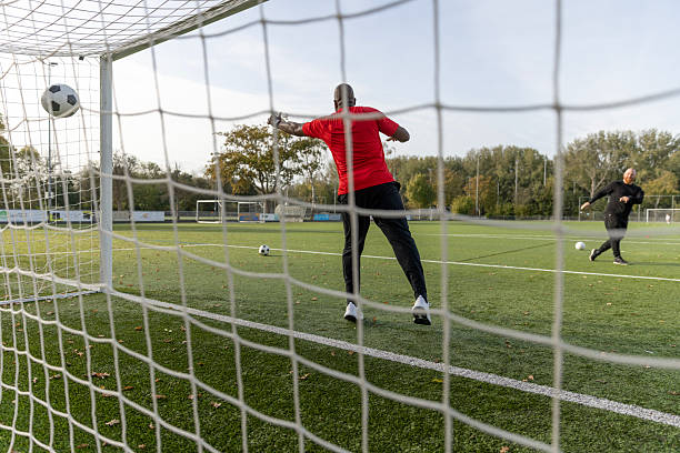 istock Father coach in goal during soccer training 2242959144