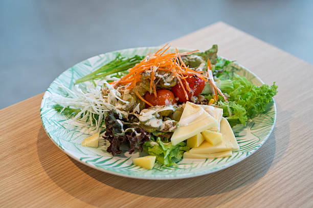 Fresh mixed salad with cheese and dressing