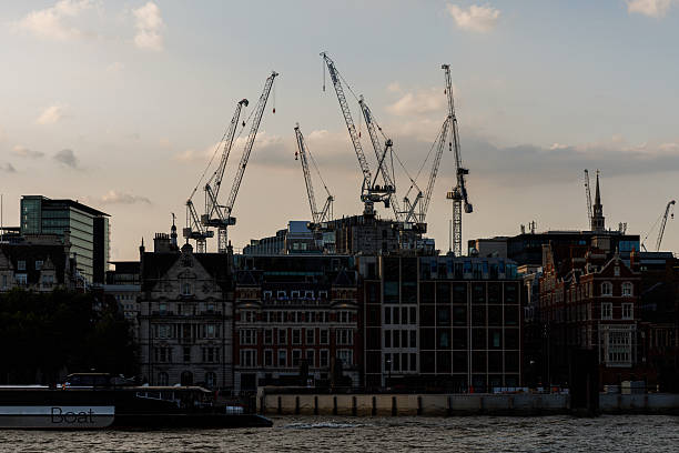 istock Construction cranes over London city skyline 2242967491