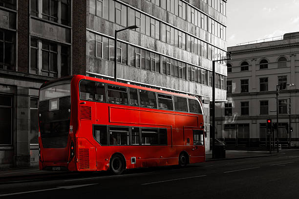 istock Red double-decker bus on London street at traffic light 2242967541