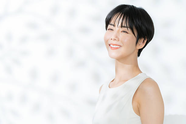 istock young woman doing beauty care on white background 2242970451