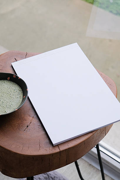 istock blank magazine mockup on coffee table with green matcha tea near window 2242970511