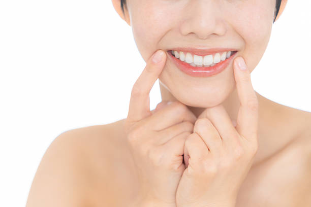 istock young woman doing beauty care on white background 2242970545
