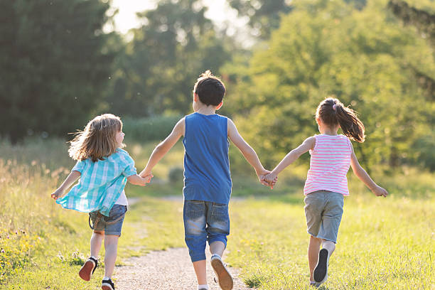 istock Children Enjoying a Run Through the Countryside 2242972809