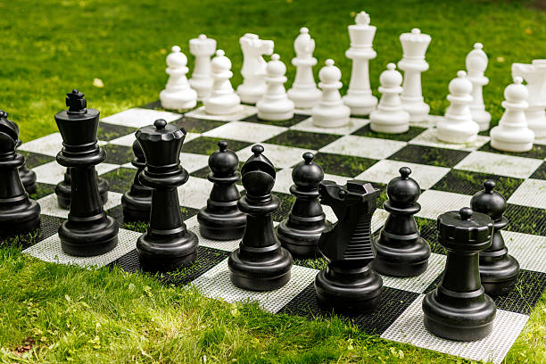 istock Outdoor chess game with large black and white pieces 2242974497