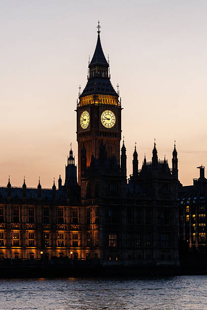 istock Close-up of illuminated Big Ben clock tower at sunset 2242974560