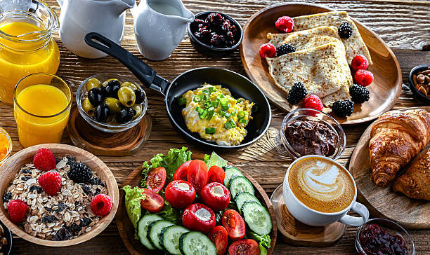istock Breakfast served with coffee, eggs, cereals and croissants 2242983003