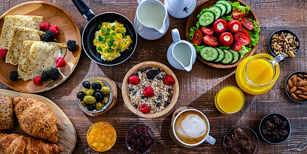 istock Breakfast served with coffee, eggs, cereals and croissants 2242983029
