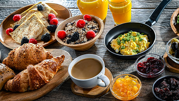 istock Breakfast served with coffee, eggs, cereals and croissants 2242983049