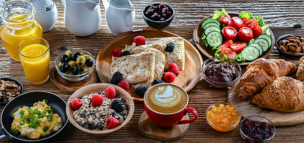 istock Breakfast served with coffee, eggs, cereals and croissants 2242983078
