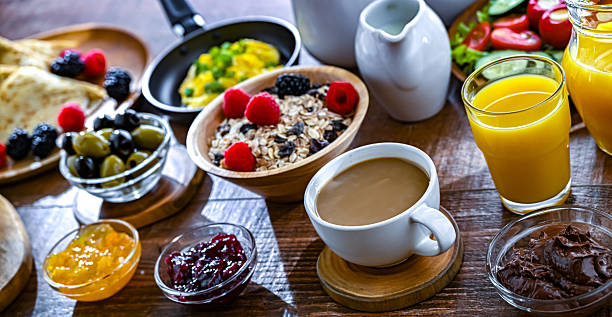 istock Breakfast served with coffee, eggs, cereals and croissants 2242983220