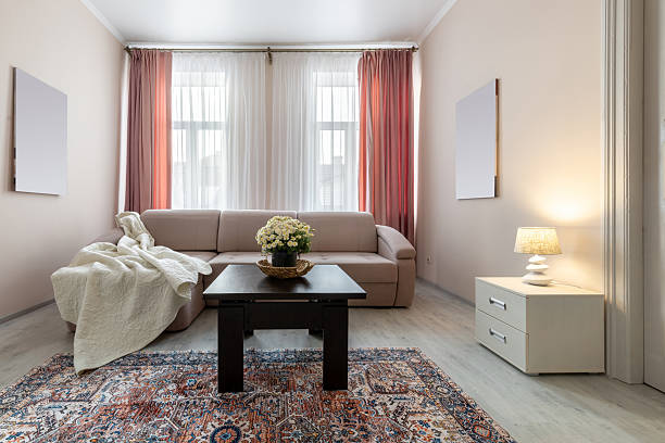 istock Cozy Bright Living Room with Sofa and Warm Lighting 2242984280