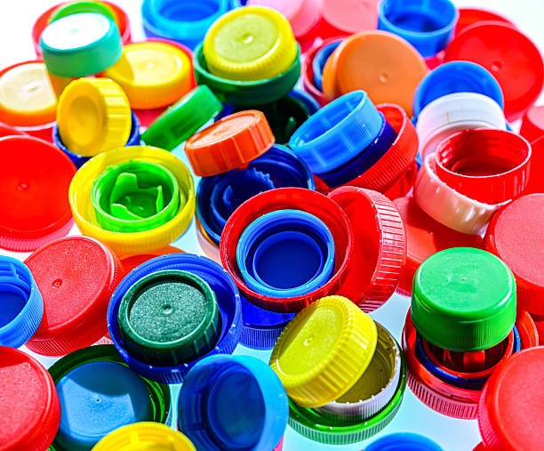 istock Different sorts of colorful plastic bottle caps. Recycling 2242984712
