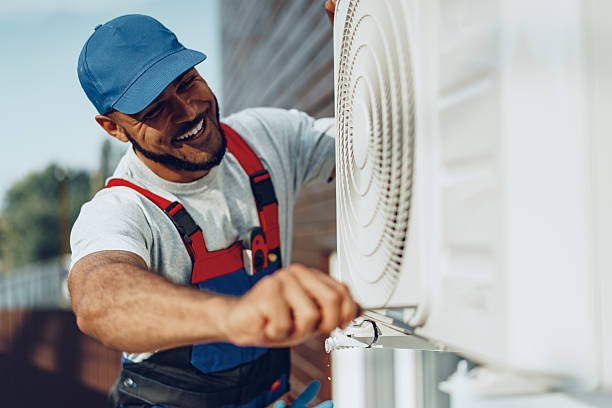 istock Young black man repairman checking an outside air conditioner unit 2242984832