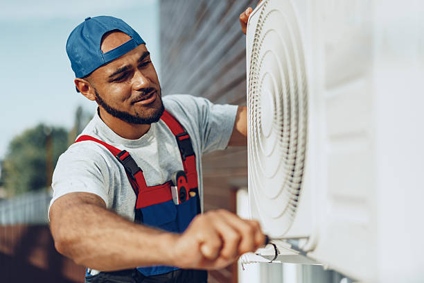 istock Young black man repairman checking an outside air conditioner unit 2242987270