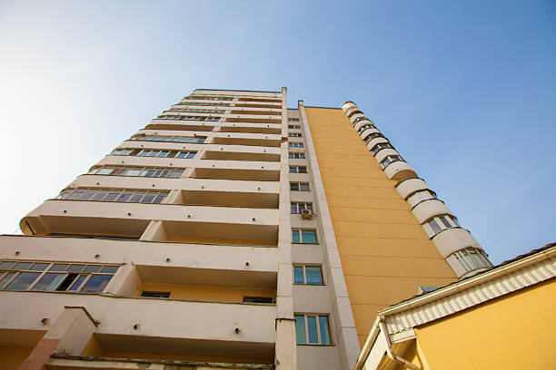Modern residential building under clear blue sky during daylight