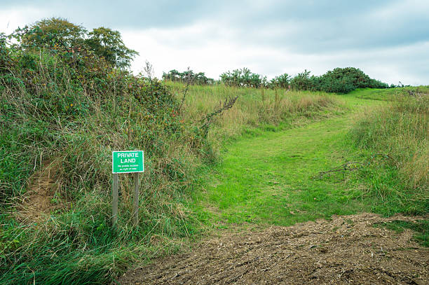 istock Private Land sign seen at the edge of a private paddock. 2242992187