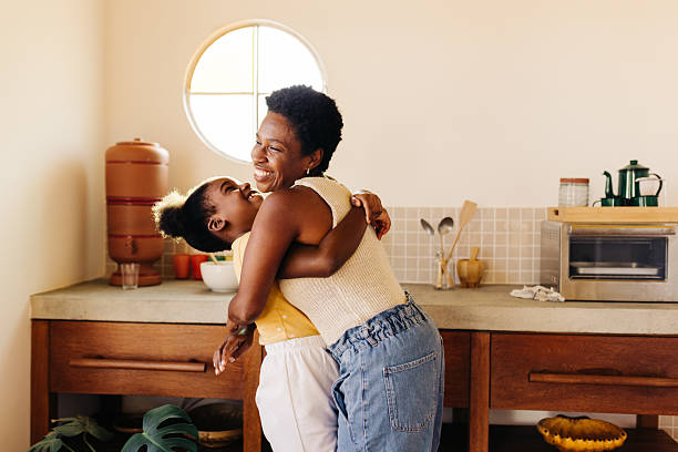 istock Young girl having fun with her mom in the kitchen 2242993450