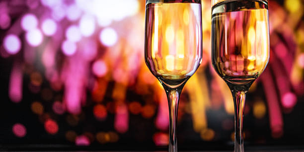 istock Elegant romantic celebration, Stylish evening with glowing glasses and celebratory fireworks 2242996248