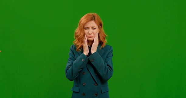 istock Woman suffering from toothache footage on green screen background. 2242997736