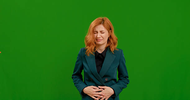 istock Woman demonstrating various gestures in a studio setting with green background 2242998253